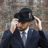 Model wearing men's black crushable felt fedora