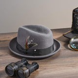 Men's gray trilby on table