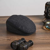 Men's black caddie cap - on table