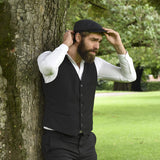 Model wearing men's black herringbone ivy cap